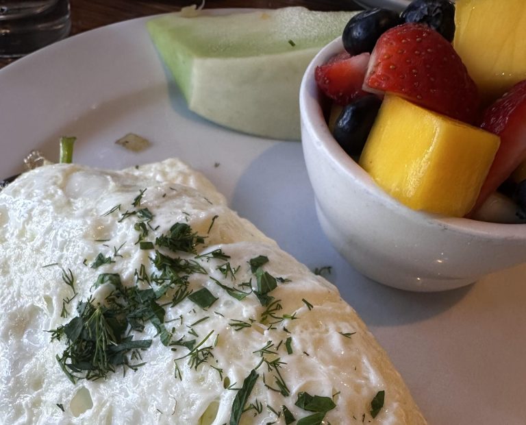 Breaking eggs, making omelettes at Metro Cafe 